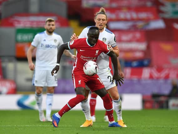 NICE FEELING - Luke Ayling held his own against Sadio Mané in Leeds United's first Premier League game against Liverpool at Anfield. Pic: Getty