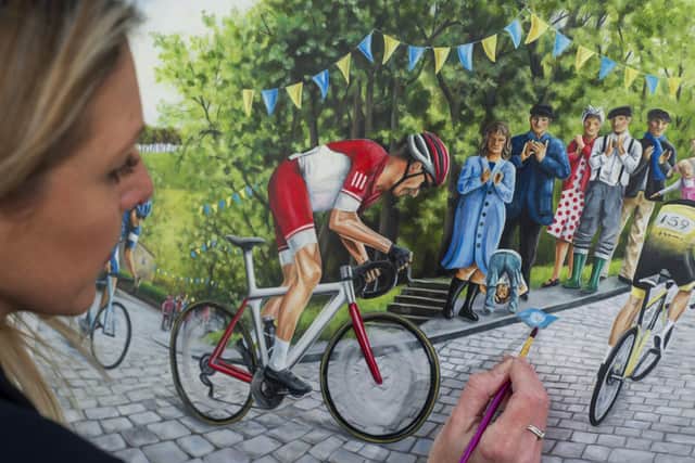 Claire Baxter with her painting of Shibden Wall in Halifax.