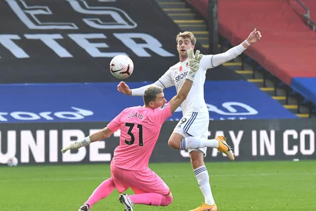 'LUDICROUS': Leeds United striker Patrick Bamford chips Crystal Palace 'keeper Vicente Guaita to seemingly put the Whites level only for VAR to rule out the goal for being offside with his arm. Photo by Glyn Kirk - Pool/Getty Images.