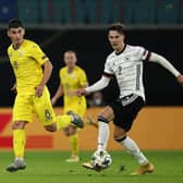 'GOOD JOB': From Leeds United's Robin Koch, right, pictured controlling the ball ahead of Ruslan Malinovskyi during Saturday evening's 3-1 victory against UEFA Nations League visitors Ukraine. Photo by Maja Hitij/Getty Images.