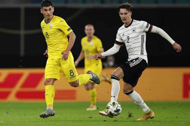 'GOOD JOB': From Leeds United's Robin Koch, right, pictured controlling the ball ahead of Ruslan Malinovskyi during Saturday evening's 3-1 victory against UEFA Nations League visitors Ukraine. Photo by Maja Hitij/Getty Images.
