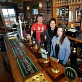 Jack Messenger, Louise Waters and Lou Clarke from Harry's Bar in Wakefield, which was named CAMRA Pub of the Year in 2018.