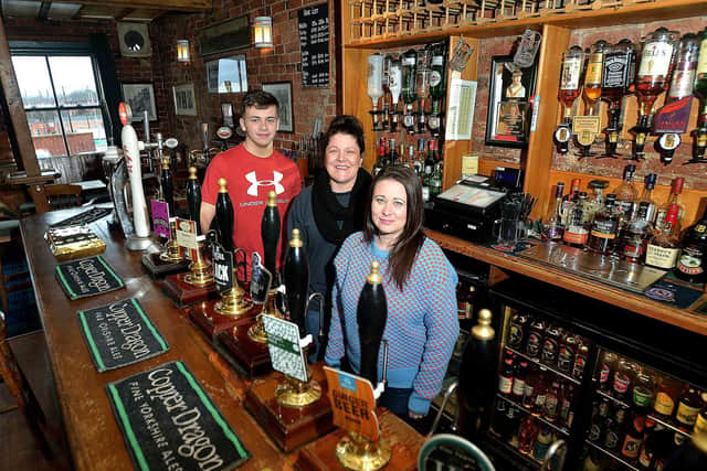 Jack Messenger, Louise Waters and Lou Clarke from Harry's Bar in Wakefield, which was named CAMRA Pub of the Year in 2018.