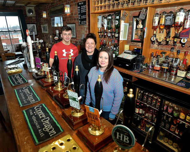 Jack Messenger, Louise Waters and Lou Clarke from Harry's Bar in Wakefield, which was named CAMRA Pub of the Year in 2018.