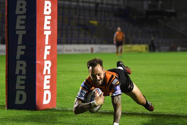 Gareth O'Brien touches down for Tigers. Picture by Jonathan Gawthorpe.