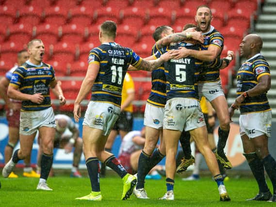 Rhinos players celebrate their Cup semi-final win over Wigan. Picture by Bruce Rollinson.