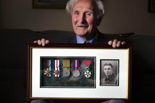 Jim Pass, pictured in 2018 with his war medals. Picture: Scott Merrylees