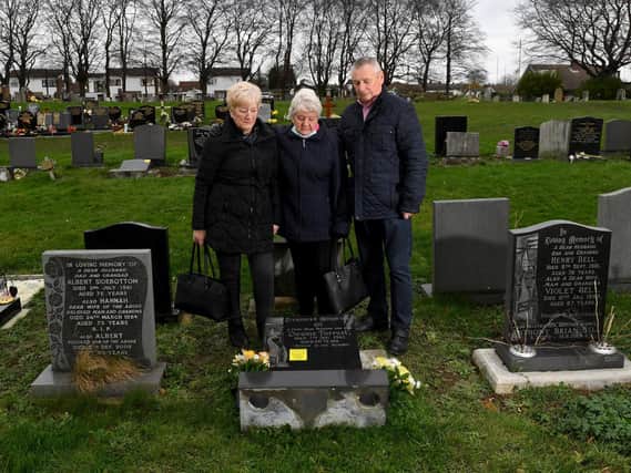 The headstone  of Dennis Forrest's grave has been  tipped over at Rothwell Cemetery.
 Dennis's widow Mavis is pictured with his daughter Susan and son in law Dennis Brewster.
Picture by Simon Hulme