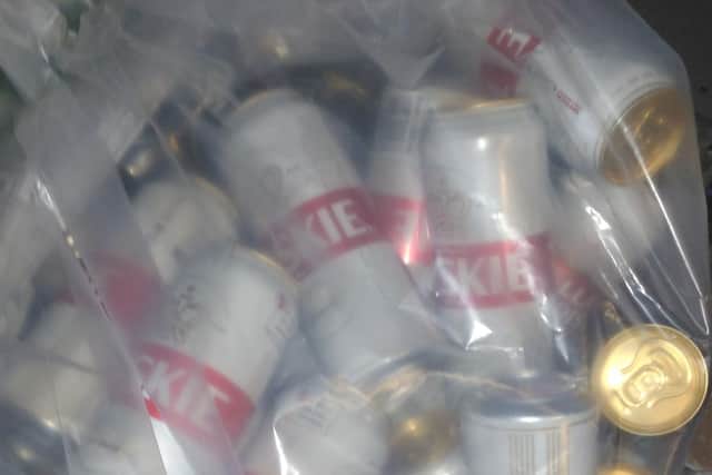 Officers seized these tins of Tyskie beer after a shop continued to sell alcohol without a license.