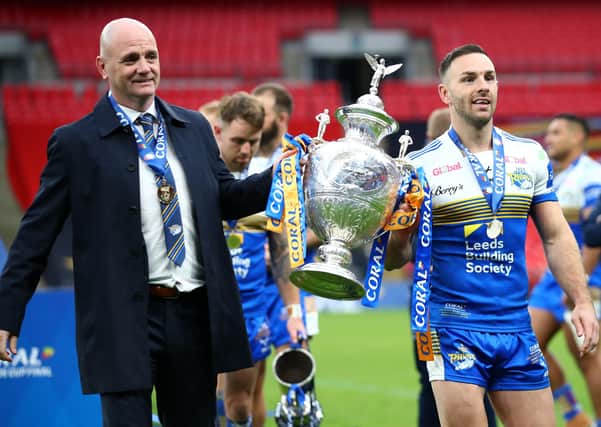 CROWNING GLORY: Leeds Rhinos head coach Richard Agar and Luke Gale celebrate with the Challenge Cup trophy after beating Salford Red Devils at Wembley. Picture: Michael Steele/Getty Images