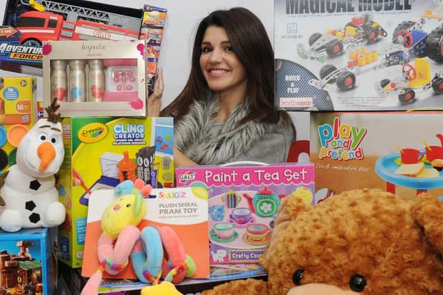 Natalie Anderson pictured sorting gifts for the Cash for Kids Mission Christmas appeal in 2017.