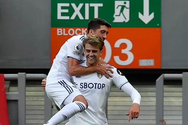 MORE OF THE SAME PLEASE: Leeds United's Patrick Bamford (right) celebrates scoring his side's second goal of the game against Liverpool at Anfield with team-mate Pablo Hernandez. Picture: Paul Ellis/NMC Pool/PA