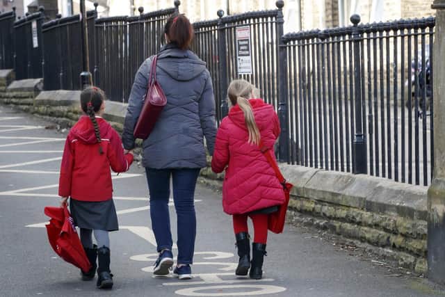 Parents leaving school in Leeds (photo: PA).