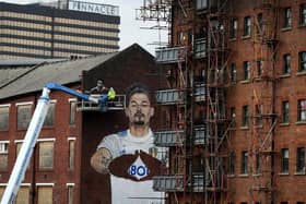 The Leeds United mural underway in Leeds city centre