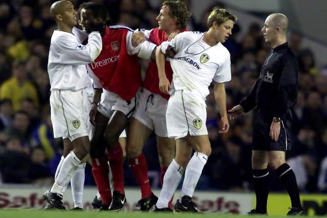 HEATED: Leeds United match-winner Olivier Dacourt, left, grabs Arsenal midfielder Patrick Vieira who himself pulls the shirt of Whites striker Alan Smith in the Premier League clash of November 2000. Photo by Phil Noble/PA.