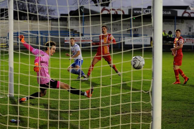 Gloucester goalkeeper Louie Moulden saves Dan Cowan's shot with his foot at Nethermoor yesterday. Picture: Steve Riding.