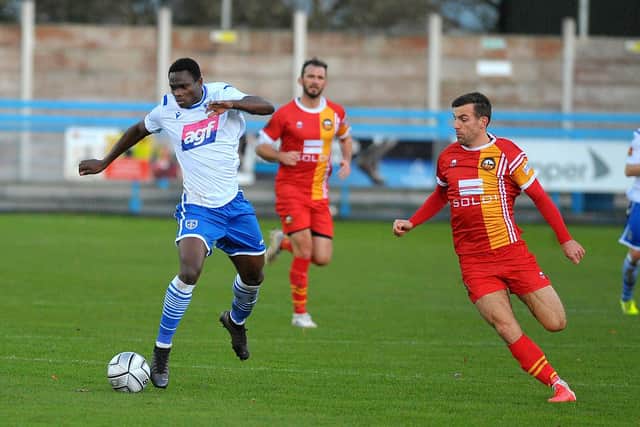 Prince Ekpolo of Guiseley on the run against Gloucester City. Picture: Steve Riding.