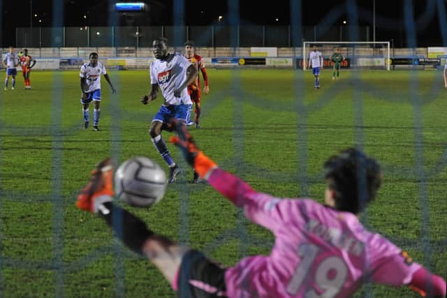 Guiseley's Lebrun Mbeka beats Gloucester goalkeeper Louie Moulden from the penalty spot but the Lions could not find an equaliser in a 2-1 defeat. Picture: Steve Riding.