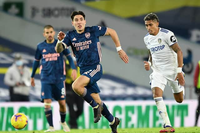 MIXED FEELINGS: For Arsenal defender Hector Bellerin, left, pictured trying to get away from Leeds United winger Raphinha in Sunday's goalless draw at Elland Road. Photo by David Price/Arsenal FC via Getty Images.