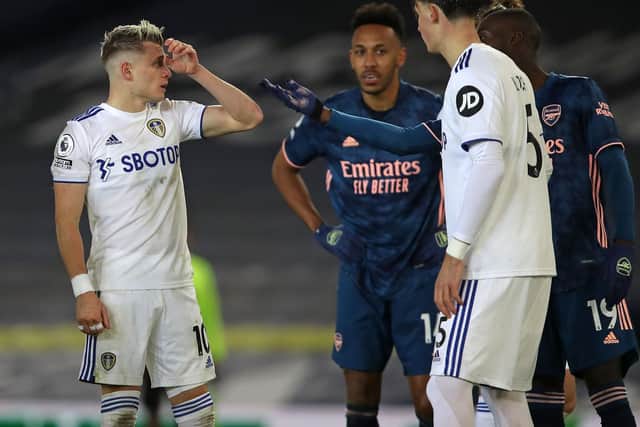 FLASHPOINT: Between Gjanni Alioski, left, and Nicolas Pepe, right, after their clash in Sunday's contest at Elland Road in which Pepe was sent off for dropping his head in Alioski's face. Photo by MOLLY DARLINGTON/POOL/AFP via Getty Images.