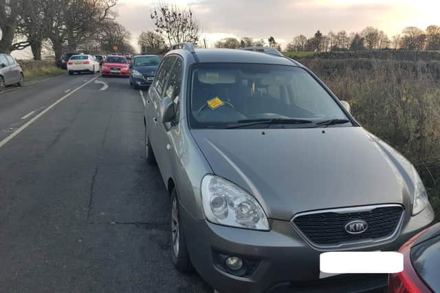 A car is issued with a fixed penalty notice for obstructing the road (Image: WYP)