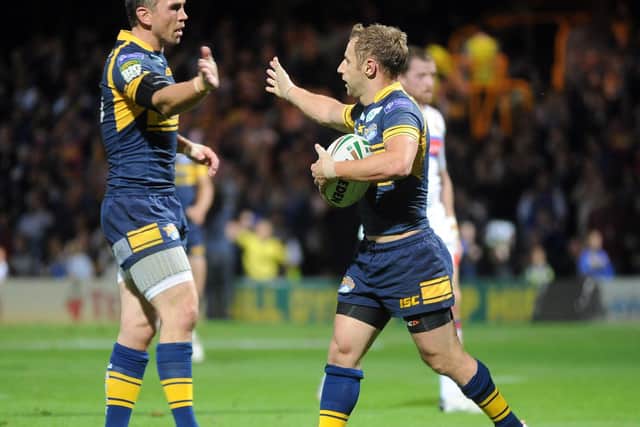 Sinfield, left and Burrow celebrate a try in 2012. Picture by Steve Riding.