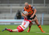 Castleford Tigers' Oliver Holmes is tackled by St Helens' Theo Fages. Picture: Alex Whitehead/SWpix.com.