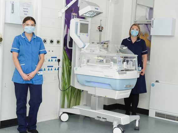 Staff nurse  Lizzy Colley (left) and lead nurse Laura Ealham with the new incubator at the neonatal unit at Leeds General Infirmary.