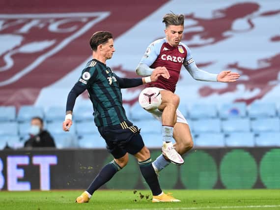 NEW STYLE - Robin Koch, seen here defending against Aston Villa's Jack Grealish, is relishing the new territory he gets to explore under Marcelo Bielsa's approach at Leeds United. Pic: Getty