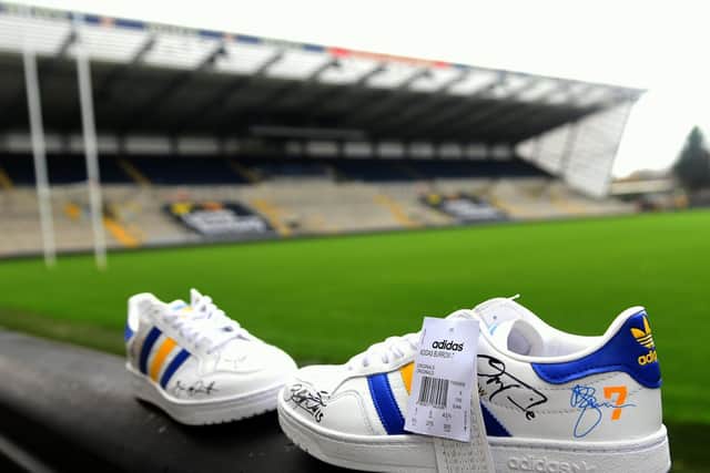 The unique customised Adidas Rob Burrow trainers signed by Leeds Rhinos players.
