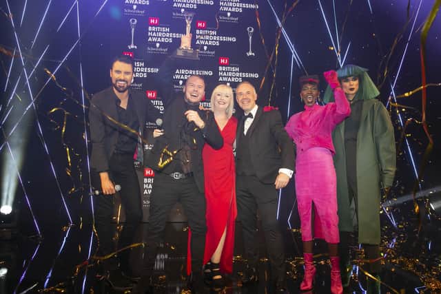 Robert Eaton picking up his British Hairdresser of the Year award at last year's British Hairdressing Awards, presented by Rylan Clark-Neal, far left.