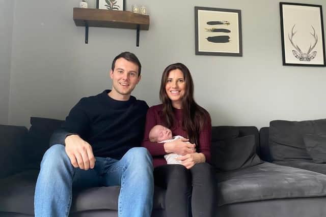 Baby Archie pictured with dad Chris Burns and mum Emma Bailey