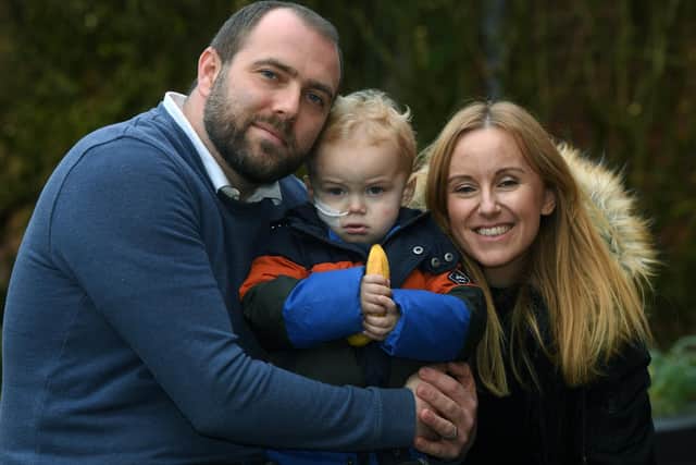 Max Kuc pictured with parents Lucy and Chris.
Photo: Jonathan Gawthorpe