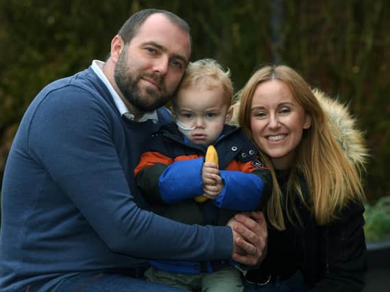 Max Kuc pictured with parents Lucy and Chris.

Photo: Jonathan Gawthorpe