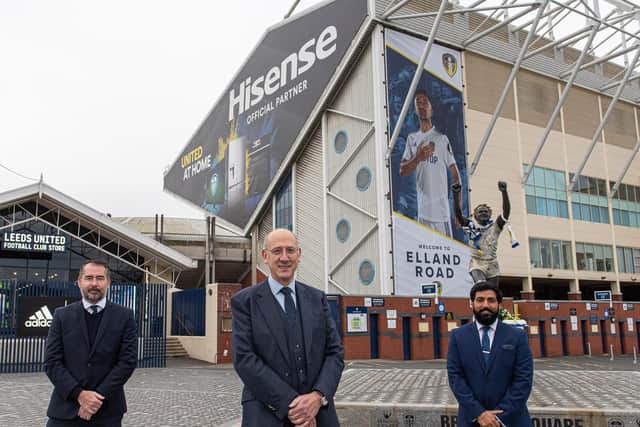 NEW PARTNERS - Leeds United commercial director Paul Bell, left, with Hisense UK vice president Howard Grindrod and Arun Bhatoye at Elland Road where the East Stand bears their branding