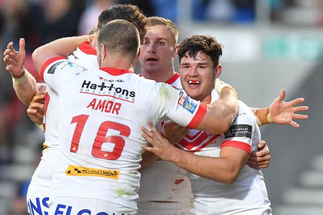James Bentley is congratulated on scoring a try by his St Helens' team-mates last season. Picture: Dave Howarth/PA