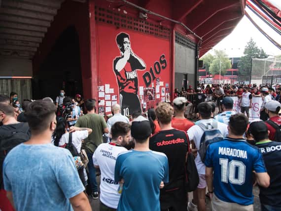 LOST IDOL - Fans of Argentina's Newell's Old Boys gather at the Marcelo Bielsa Stadium in Rosario to pay respect to legend Diego Maradona, on the day of his death. Pic: STR/AFP via Getty Images