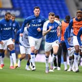 BOTH OUT: Everton left back Lucas Digne, right, and also right-back and club captain Seamus Coleman, centre, pictured warming up before October's Merseyside derby at home to Liverpool. Photo by Laurence Griffiths/Getty Images.