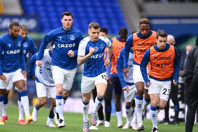 BOTH OUT: Everton left back Lucas Digne, right, and also right-back and club captain Seamus Coleman, centre, pictured warming up before October's Merseyside derby at home to Liverpool. Photo by Laurence Griffiths/Getty Images.