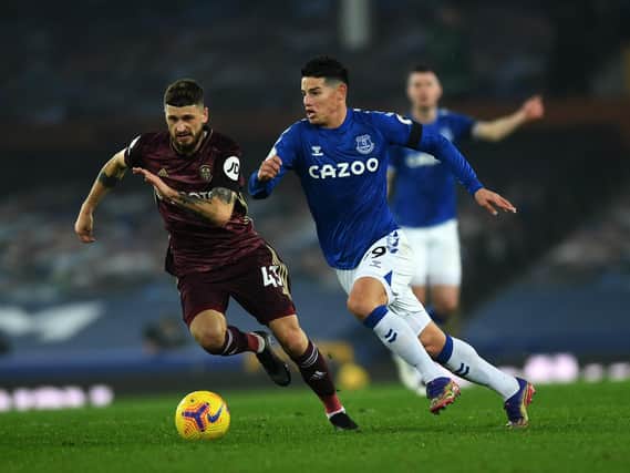 CLEAR IDEA - Leeds United are by now well versed in their man marking system and attacking philosophy, brought in by head coach Marcelo Bielsa and impressed Carlo Ancelotti at Goodison Park. Mateusz Klich is pictured chasing Everton's James Roriguez. Pic: Jonathan Gawthorpe.