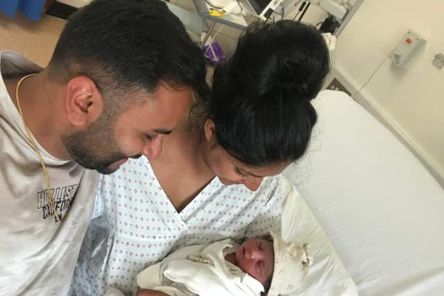 Mitesh Parmar and Nisha Bharath-Parmar with baby Prem the day he was born in June 2020.