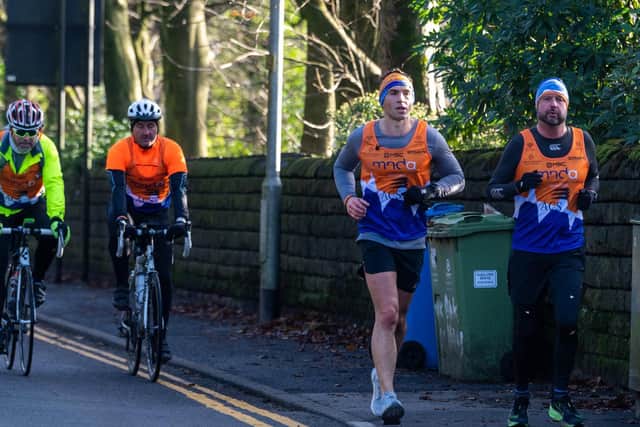 Leeds Rhino's legend Kevin Sinfield, along with his support team, making their way to the finishing point on Day 1 of this challenge. Picture: James Hardisty