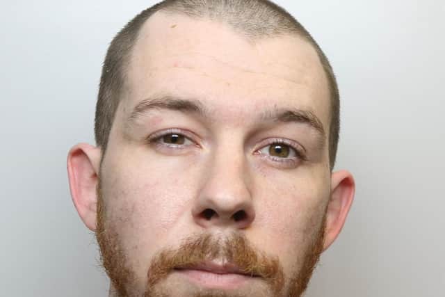 Adam Armitage was jailed for 20 months for attacking his partner with a pair of scissors.