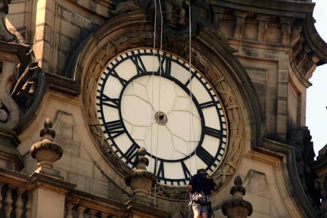 Steeplejacks remove the hands from the clock on Leeds Town Hall in July 2006. PIC: Tony Johnson