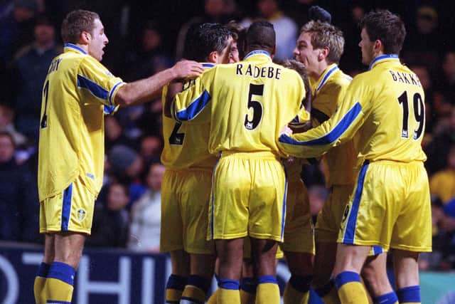 Leeds United's players mob Stephen McPhail after his second goal gave Leeds United their last victory at Chelsea in 1999.