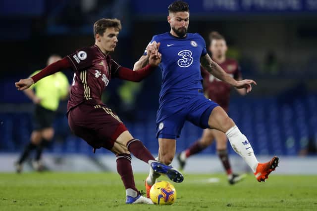 Diego Llorente is challenged by Olivier Giroud. Picture: Matthew Childs/Getty Images.