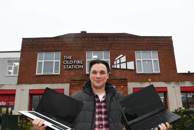 Ben McKenna with donated laptops and the Old Fire Station in Gipton which is a drop-off point.