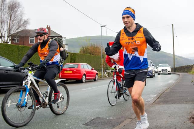 Kevin Sinfield during his final marathon challenge around Saddleworth today. Picture: Bruce Rollinson.