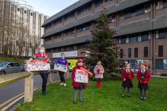 Pictured outside Leeds Children's Hospital are Lisa Beaumont - play manager at Leeds Children's Hospital - and Helen Stella-McDonald, fundraiser for Leeds Cares, with Lilyana Myers and her friends Heidi Hogg, aged five , of Roundhay, and twin sisters Olive and Ivy Adamson, aged four, of Alwoodley.
Photo: James Hardisty