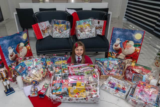 Lilyana Myers pictured with some of the handmade Christmas hampers